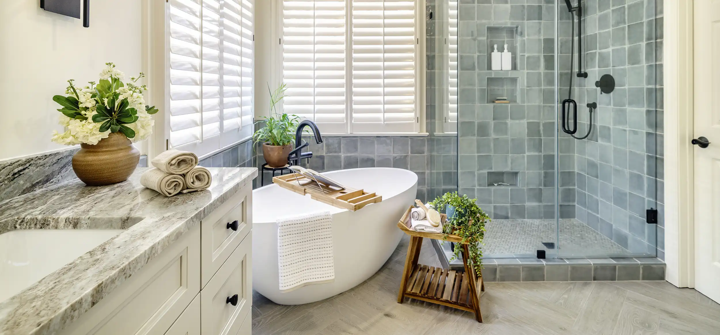 Elegant bathroom remodel showcasing a modern design with sleek fixtures, updated tiles, and a luxurious bathtub. Perfect example of bath remodeling, bath renovation, and bath remodel near me.